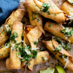These Sweet Potato Rolled Tacos are filled with mashed sweet potatoes, pinto beans & seasonings. Wrapped in corn tortillas and cooked until crispy | ThisSavoryVegan.com #thissavoryvegan #rolledtacos #vegantaquitos