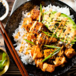 These Maple Sriracha Tofu Bowls have the perfect amount of sweetness & spice. Served over rice with spicy mayo & sesame seeds | ThisSavoryVegan.com #thissavoryvegan #tofubowls #vegandinnerideas