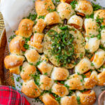 This Pigs in a Blanket Wreath is made with crescent dough & vegan hot dogs. Served with warm vegan cheese and a jalapeño agave glaze | ThisSavoryVegan.com #thissavoryvegan #holidayappetizers #christmasappetizers