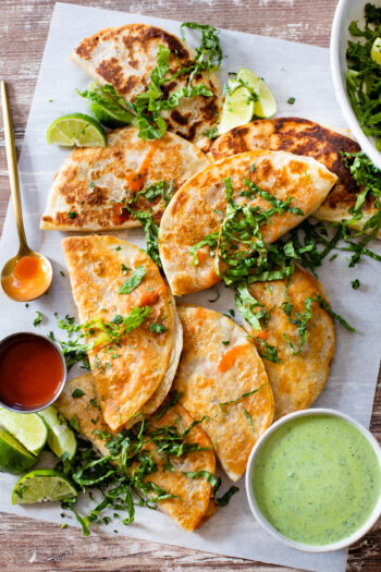 These White Bean Buffalo Tacos are filled with poblano peppers, salsa verde, white beans & buffalo sauce. Served with a creamy vegan cilantro sauce | ThisSavoryVegan.com #thissavoryvegan #vegantacos #buffalotacos