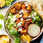 This Greek Tofu & Veggies recipe is full-proof. Marinated tofu is baked until crispy and served with a non-dairy lemon yogurt sauce | ThisSavoryVegan.com #thissavoryvegan #tofurecipe #greektofu