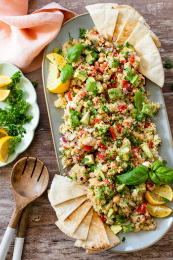 This Mediterranean Quinoa Salad is a healthy and easy meal - filled with quinoa, avocado, roasted red peppers, chickpeas & vegan feta | ThisSavoryVegan.com #thissavoryvegan #quinoasalad #saladrecipes