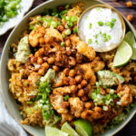 This Roasted Cauliflower & Salsa Verde Rice is an amazing plant based dinner! Flavor-packed rice, crispy cauliflower & chickpeas | ThisSavoryVegan.com #thissavoryvegan #cauliflowerrecipes #plantbased
