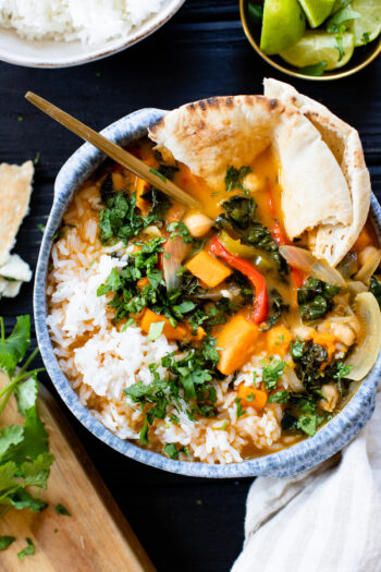 This Slow Cooker Sweet Potato Curry is creamy, comforting, veggie packed and delicious. A simple vegan dinner idea | ThisSavoryVegan.com #thissavoryvegan #slowcookerrecipes #vegancurry