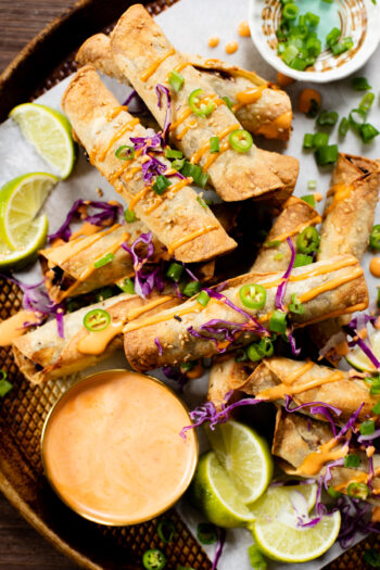 These Vegan Korean Beef Taquitos are addicting! Saucy vegan beef crumbles in corn tortillas & air-fried until crispy. Served with spicy mayo | ThisSavoryVegan.com #thissavoryvegan #taquitos #airfryerrecipes