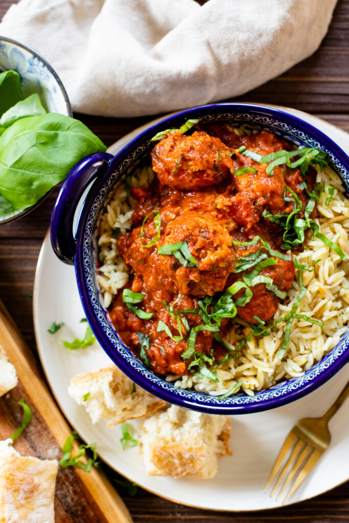 These Vegan Turkey Meatballs & Orzo are the best vegan dinner! Meatballs are simmered in marinara sauce before being served over garlic basil orzo | ThisSavoryVegan.com #thissavoryvegan #veganmeatballs #easyvegandinner