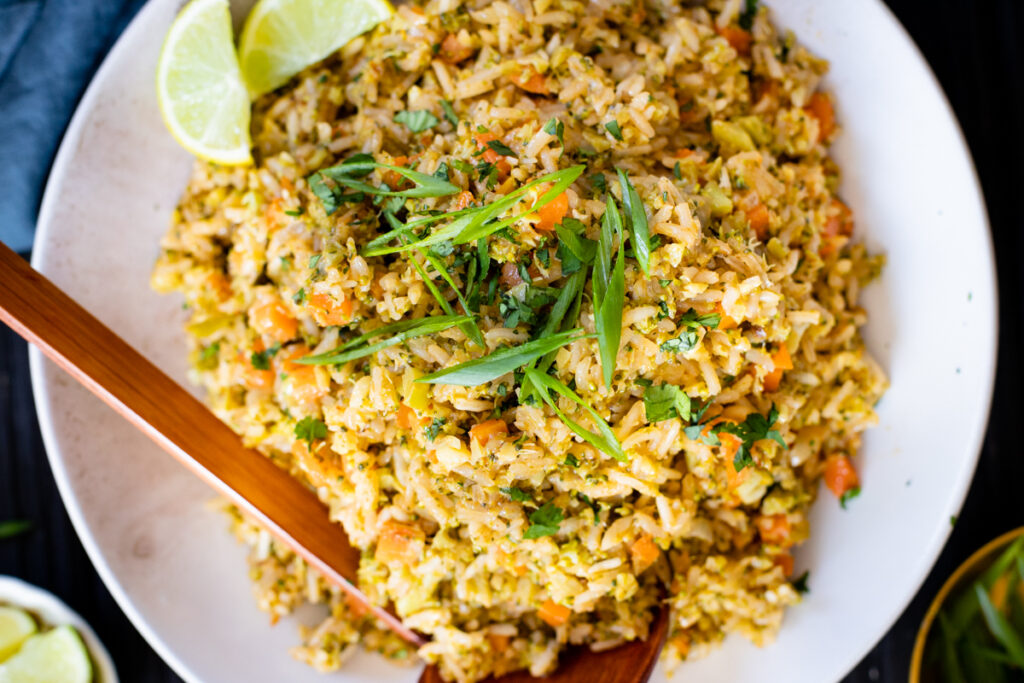 This Broccoli Coconut Rice Stir-Fry is an easy vegan dinner that is packed with sneaky veggies. Serve with your favorite tofu for an easy weeknight dinner | ThisSavoryVegan.com #thissavoryvegan #coconutrice #friedrice