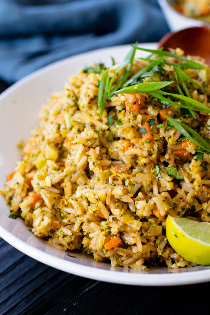 This Broccoli Coconut Rice Stir-Fry is an easy vegan dinner that is packed with sneaky veggies. Serve with your favorite tofu for an easy weeknight dinner | ThisSavoryVegan.com #thissavoryvegan #coconutrice #friedrice