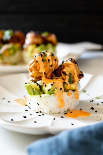 These Teriyaki Cauliflower Rice Stacks are layered with sticky rice, seasoned avocado and roasted cauliflower coated in teriyaki sauce | ThisSavoryVegan.com #thissavoryvegan #ricestacks #roastedcauliflower