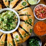 This Vegan Taco Crescent Ring is a fun party appetizer filled with chipotle lentils and served with guacamole, salsas & lime wedges | ThisSavoryVegan.com #thissavoryvegan #veganappetizers #veganpartyfood