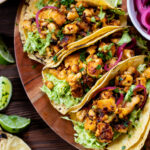 These Chipotle Agave Tofu Tacos have crispy tofu, a tangy slaw, mashed avocado & non-dairy cilantro yogurt sauce - the perfect vegan tacos | ThisSavoryVegan.com #thissavoryvegan #vegantacos #tofutacos