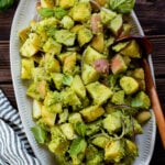 This Pistachio Pesto Potato Salad is light, dairy-free and mayo-free. Made with fresh pesto and thinly sliced red onion. A great vegan side dish | ThisSavoryVegan.com #thissavoryvegan #potatosalad #veganpotatosalad