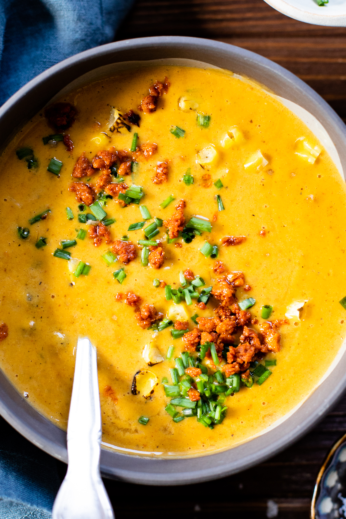 This dairy-free Sweet Potato Corn Chowder is filled with a creamy broth, crispy soyrizo, sweet corn and tender sweet potatoes | ThisSavoryVegan.com #thissavoryvegan #dairyfreesoup #vegansoup