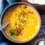 This dairy-free Sweet Potato Corn Chowder is filled with a creamy broth, crispy soyrizo, sweet corn and tender sweet potatoes | ThisSavoryVegan.com #thissavoryvegan #dairyfreesoup #vegansoup
