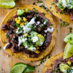 These Black Bean Tostadas with Avocado Salsa are layered with refried beans, seasoned black beans and chunky avocado corn salsa | ThisSavoryVegan.com #thissavoryvegan #vegantostadas #veganmexicanfood