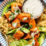 These Buffalo Tofu Couscous Bowls are filled with cilantro lime couscous, baked buffalo tofu & avocado. Served with vegan tahini ranch | ThisSavoryVegan.com #thissavoryvegan #tofurecipes #grainbowls