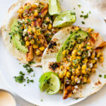 These Vegan Street Corn Tacos are filled with grilled tofu, street corn salad, avocado slices and a spicy mayo. Easy, delicious vegan tacos | ThisSavoryVegan.com #thissavoryvegan #vegantacos #mexicanstreetcorn