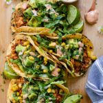 These BBQ Tofu Tacos are layered with crumbled tofu cooked in bbq sauce, avocado corn salsa, romaine and a chipotle yogurt sauce | ThisSavoryVegan.com #thissavoryvegan #vegantacos #tofutacos