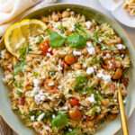This vegan Lemon Basil Pasta Salad is loaded with vegan feta, sun-dried tomatoes, chickpeas, arugula and orzo. The best vegan pasta salad recipe | ThisSavoryVegan.com #thissavoryvegan #pastasalad #veganpastasalad