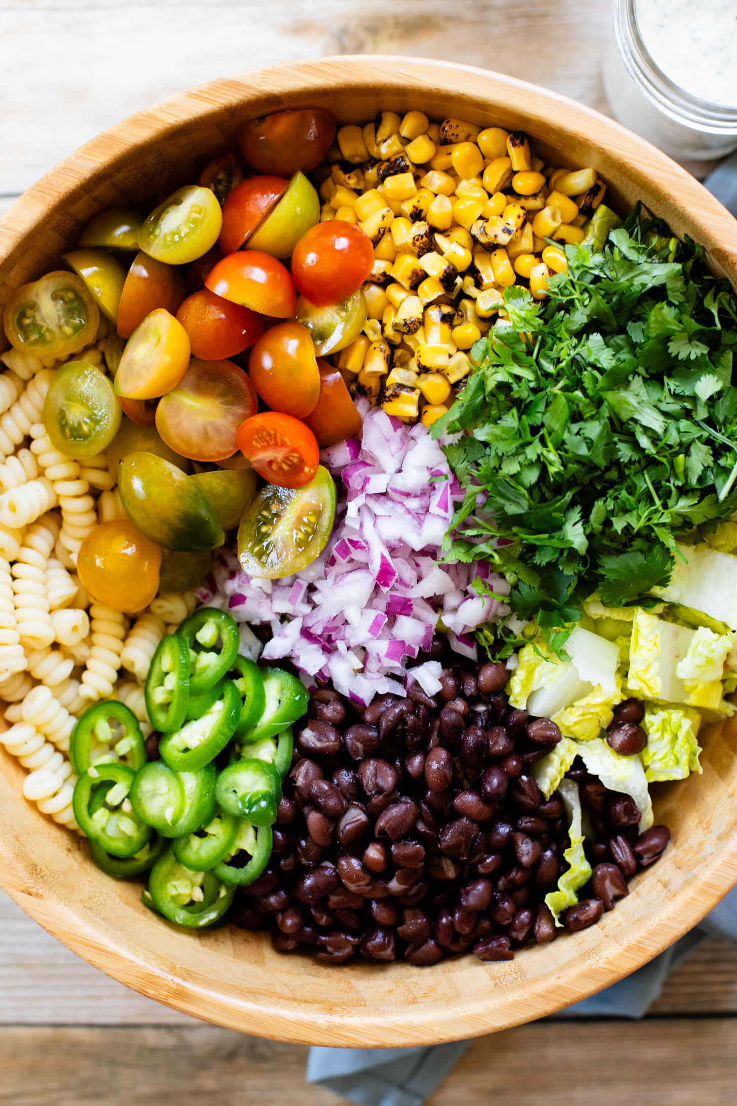 Nothing says summer like this vegan BBQ Ranch Pasta Salad - cold noodles, veggies & black beans with homemade vegan ranch & BBQ sauce | ThisSavoryVegan.com #pastasalad #summerrecipes #veganranch