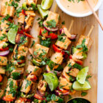 These Grilled Tofu Skewers are loaded with marinated tofu & veggies. Grilled until crispy and served with vegan spicy mayo for dipping | ThisSavoryVegan.com #thissavoryvegan #vegankabobs #summerrecipes