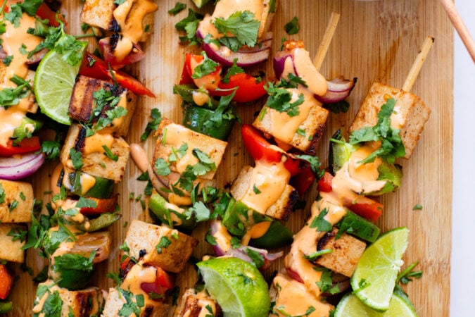 These Grilled Tofu Skewers are loaded with marinated tofu & veggies. Grilled until crispy and served with vegan spicy mayo for dipping | ThisSavoryVegan.com #thissavoryvegan #vegankabobs #summerrecipes