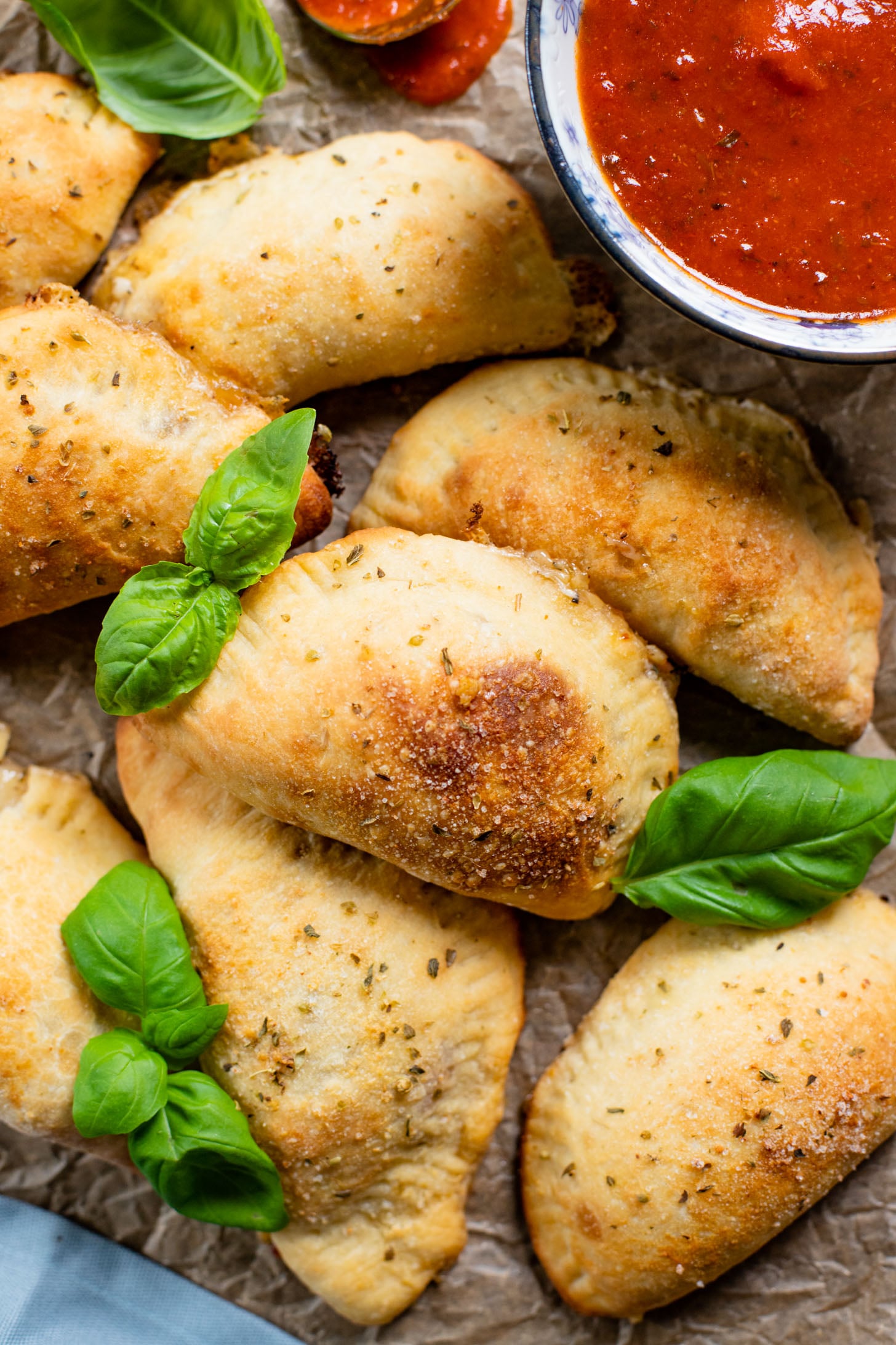 These Mediterranean Pizza Pockets are filled with vegan feta, vegan parmesan, sun-dried tomatoes, herbs & garlic. The perfect vegan snack or kid-friendly dinner | ThisSavoryVegan.com #thissavoryvegan #homemadepizzapockets #veganpizza