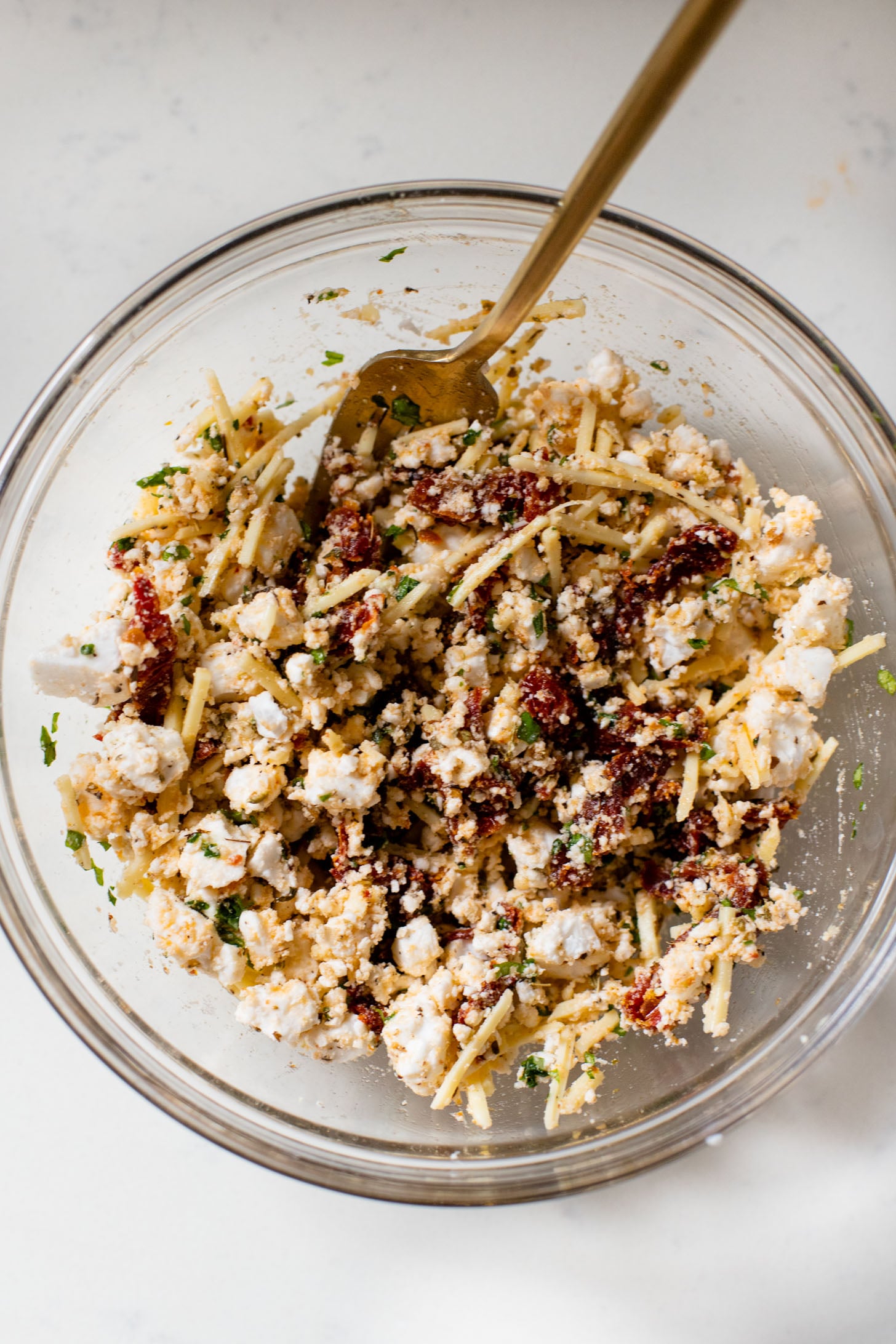 These Mediterranean Pizza Pockets are filled with vegan feta, vegan parmesan, sun-dried tomatoes, herbs & garlic. The perfect vegan snack or kid-friendly dinner | ThisSavoryVegan.com #thissavoryvegan #homemadepizzapockets #veganpizza