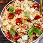 This Roasted Tomato & Basil Orzo Salad has roasted tomatoes & garlic, vegan feta, fresh basil and a balsamic dressing. Fresh, bright & delicious | ThisSavoryVegan.com #thissavoryvegan #pastasalad #summersidedish