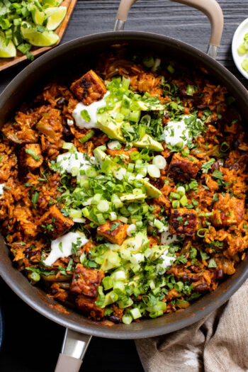 This Tempeh Enchilada Rice Skillet is the best one-pot vegan dinner recipe! Plenty of veggies, flavor-packed rice and crispy tempeh! Plus all of the tastiest plant-based toppings | ThisSavoryvegan.com #skilletdinner #vegandinnerideas #easydinnerideas