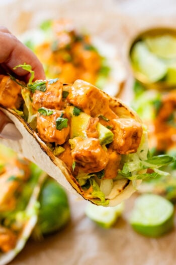 These Bang Bang Tofu Tacos have the perfect amount of spice, creaminess and crunch. The ultimate spicy vegan taco idea | ThisSavoeyVegan.com #thissavoryvegan #vegantacos #tofutacos
