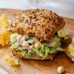 These Chickpea Caesar Salad Sandwiches are made with mashed chickpeas, vegan caesar dressing and romaine on toasted ciabatta! Perfect on-the-go meal | ThisSavoryVegan.com #thissavoryvegan #vegansandwiches #vegancaesarsalad