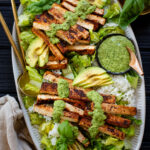 This Crispy Tofu & Rice Salad is made with marinated & baked tofu strips, rice, romaine, avocado and a delicious & tangy green dressing | ThisSavoryVegan.com #tofusalad #vegansalads #summersaladidea