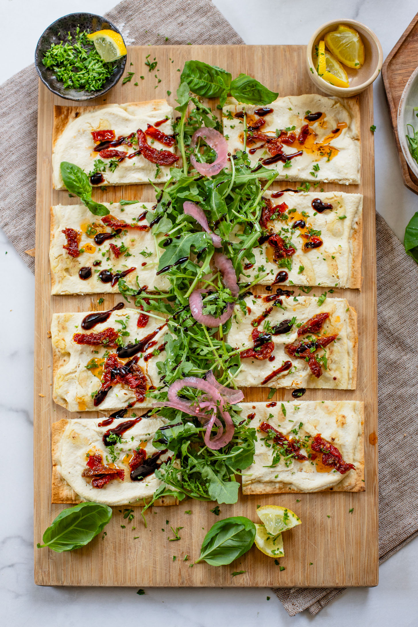 This Lemon Ricotta Lavash Pizza is the perfect vegan appetizer, lunch or light dinner! A super thin lavash crust, tofu ricotta and lots of toppings | ThisSavoryVegan.com #thissavoryvegan #veganpizza #veganappetizers