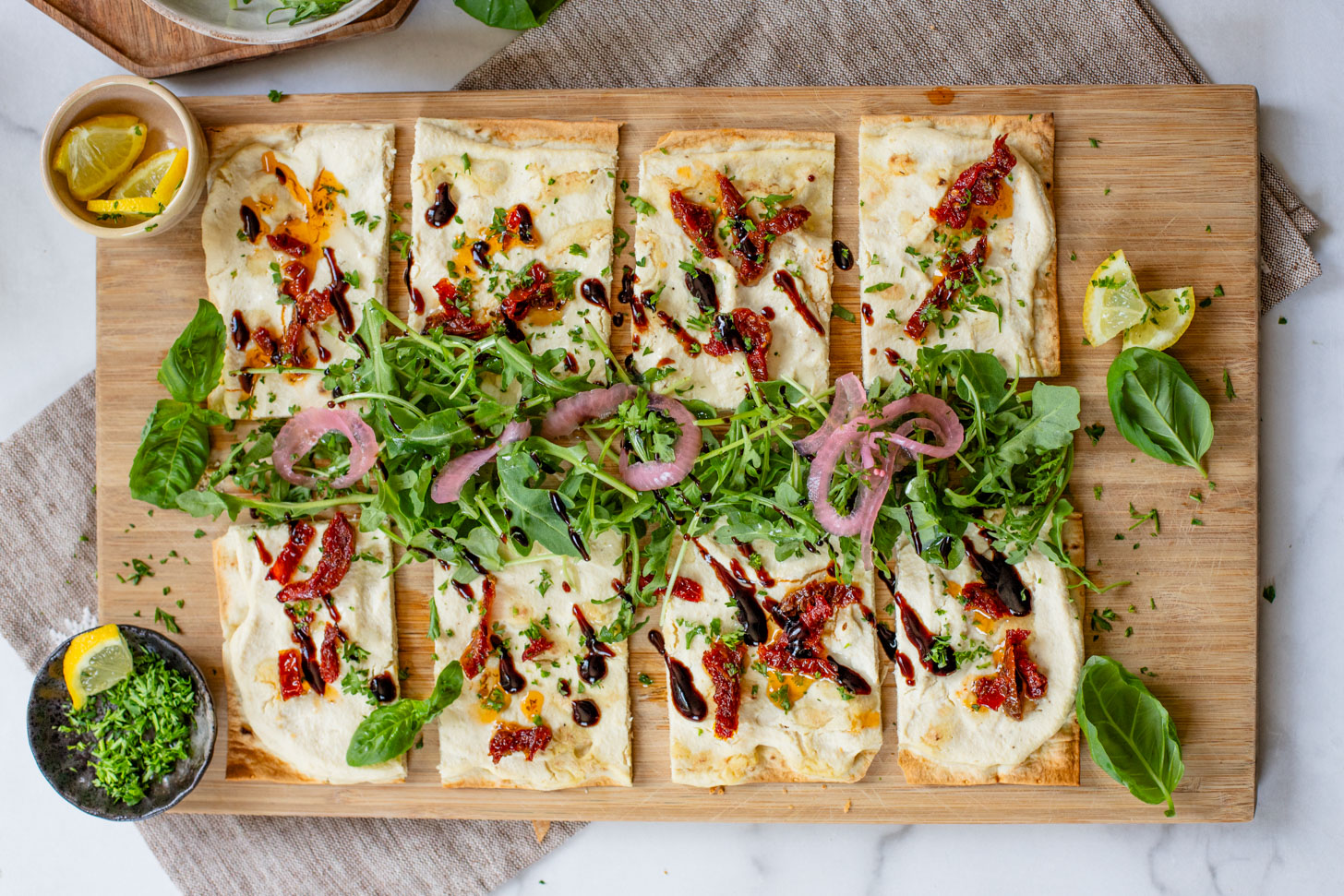 This Lemon Ricotta Lavash Pizza is the perfect vegan appetizer, lunch or light dinner! A super thin lavash crust, tofu ricotta and lots of toppings | ThisSavoryVegan.com #thissavoryvegan #veganpizza #veganappetizers
