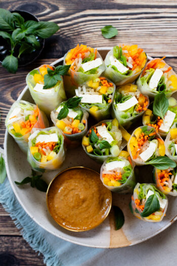 These Tofu Summer Rolls are a fresh and delicious meal. Veggie-packed and served up with the best peanut dipping sauce | ThisSavoryVegan.com #thissavoryvegan #ricepaperrolls #veganlunchideas