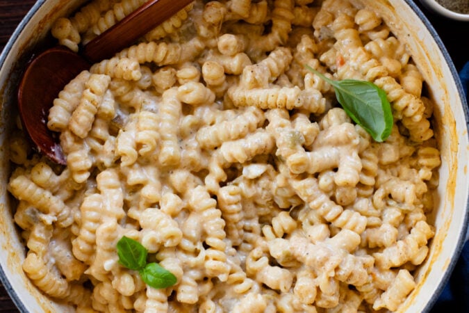 This Stovetop Vegan Mac & Cheese is made with 3 kinds of non-dairy cheese, green chiles and dry seasonings. The perfect one-pot recipe | ThisSavoryVegan.com #veganmacandcheese #onnepotrecipes #veganpasta