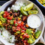 These Bean & Rice Burrito Bowls are the perfect healthy dinner. Black beans, pinto beans, rice, vegan ranch and avocado salsa | ThisSavoryVegan.com #thissavoryvegan #burritobowls #vegandinnerideas