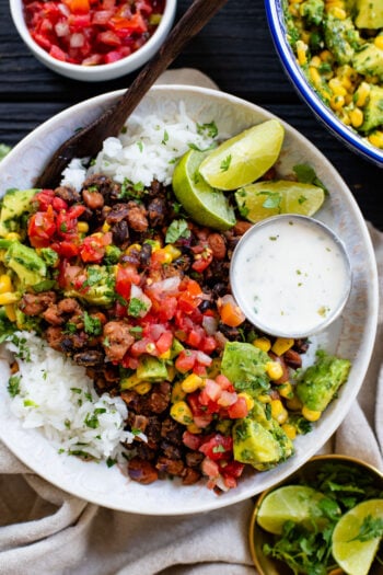 These Bean & Rice Burrito Bowls are the perfect healthy dinner. Black beans, pinto beans, rice, vegan ranch and avocado salsa | ThisSavoryVegan.com #thissavoryvegan #burritobowls #vegandinnerideas
