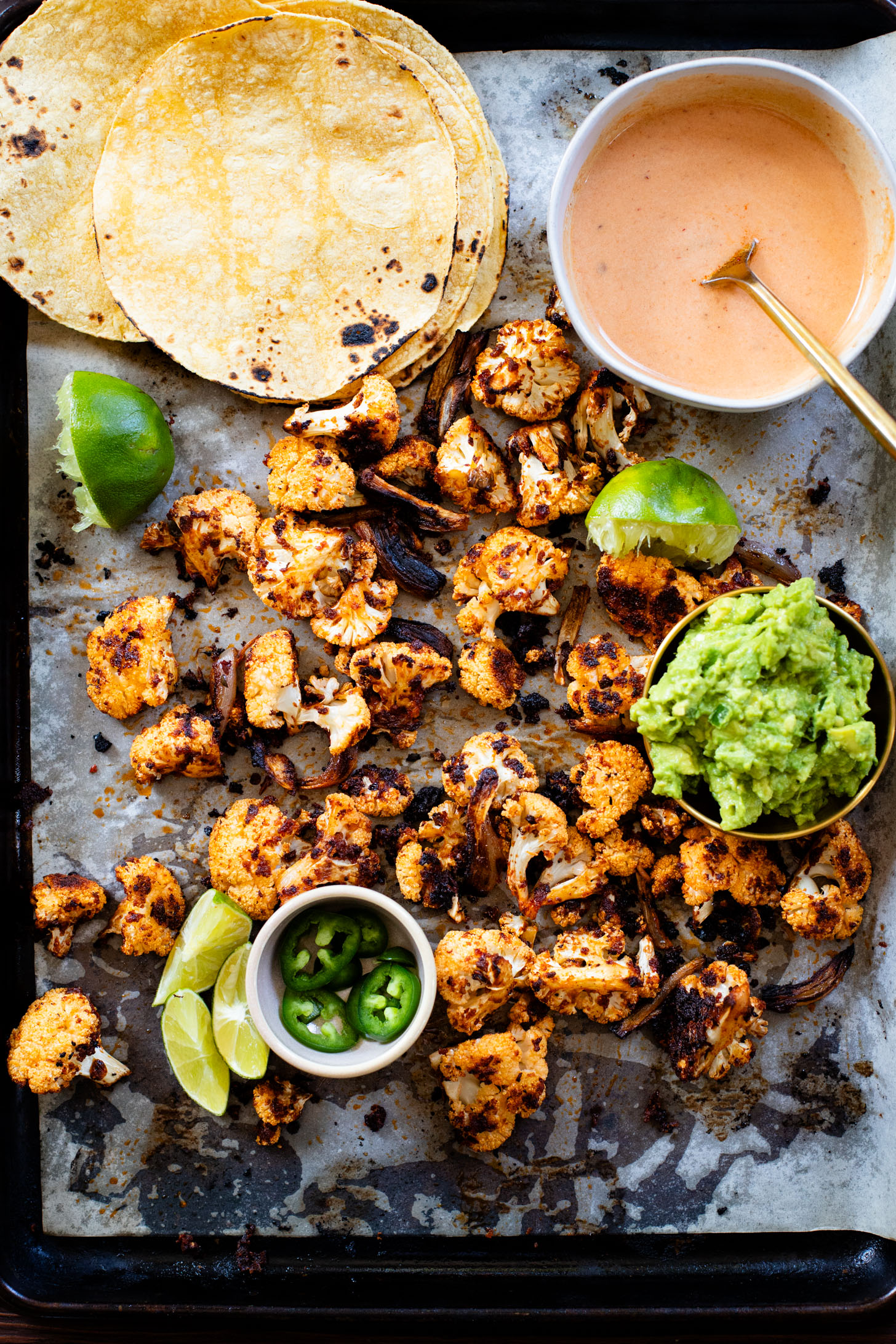 These Chipotle Cauliflower Tacos are the perfect veggie-based tacos! Crispy, roasted cauliflower, vegan chipotle yogurt sauce and simple guac | ThisSavoryVegan.com #thissavoryvegan #vegantacos #veggietacos