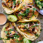 These Chipotle Cauliflower Tacos are the perfect veggie-based tacos! Crispy, roasted cauliflower, vegan chipotle yogurt sauce and simple guac | ThisSavoryVegan.com #thissavoryvegan #vegantacos #veggietacos