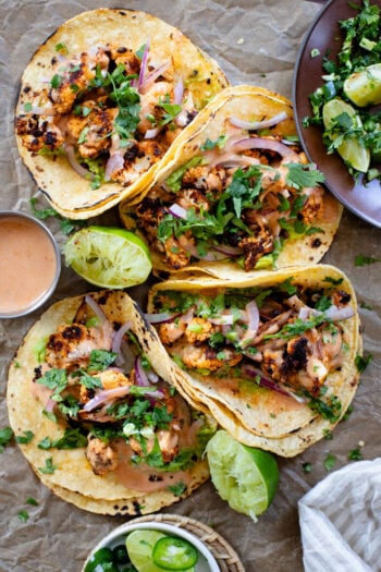These Chipotle Cauliflower Tacos are the perfect veggie-based tacos! Crispy, roasted cauliflower, vegan chipotle yogurt sauce and simple guac | ThisSavoryVegan.com #thissavoryvegan #vegantacos #veggietacos