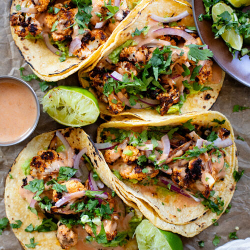 These Chipotle Cauliflower Tacos are the perfect veggie-based tacos! Crispy, roasted cauliflower, vegan chipotle yogurt sauce and simple guac | ThisSavoryVegan.com #thissavoryvegan #vegantacos #veggietacos