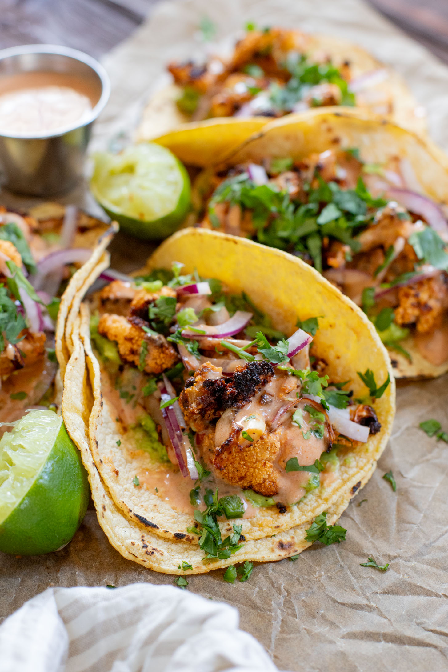 These Chipotle Cauliflower Tacos are the perfect veggie-based tacos! Crispy, roasted cauliflower, vegan chipotle yogurt sauce and simple guac | ThisSavoryVegan.com #thissavoryvegan #vegantacos #veggietacos