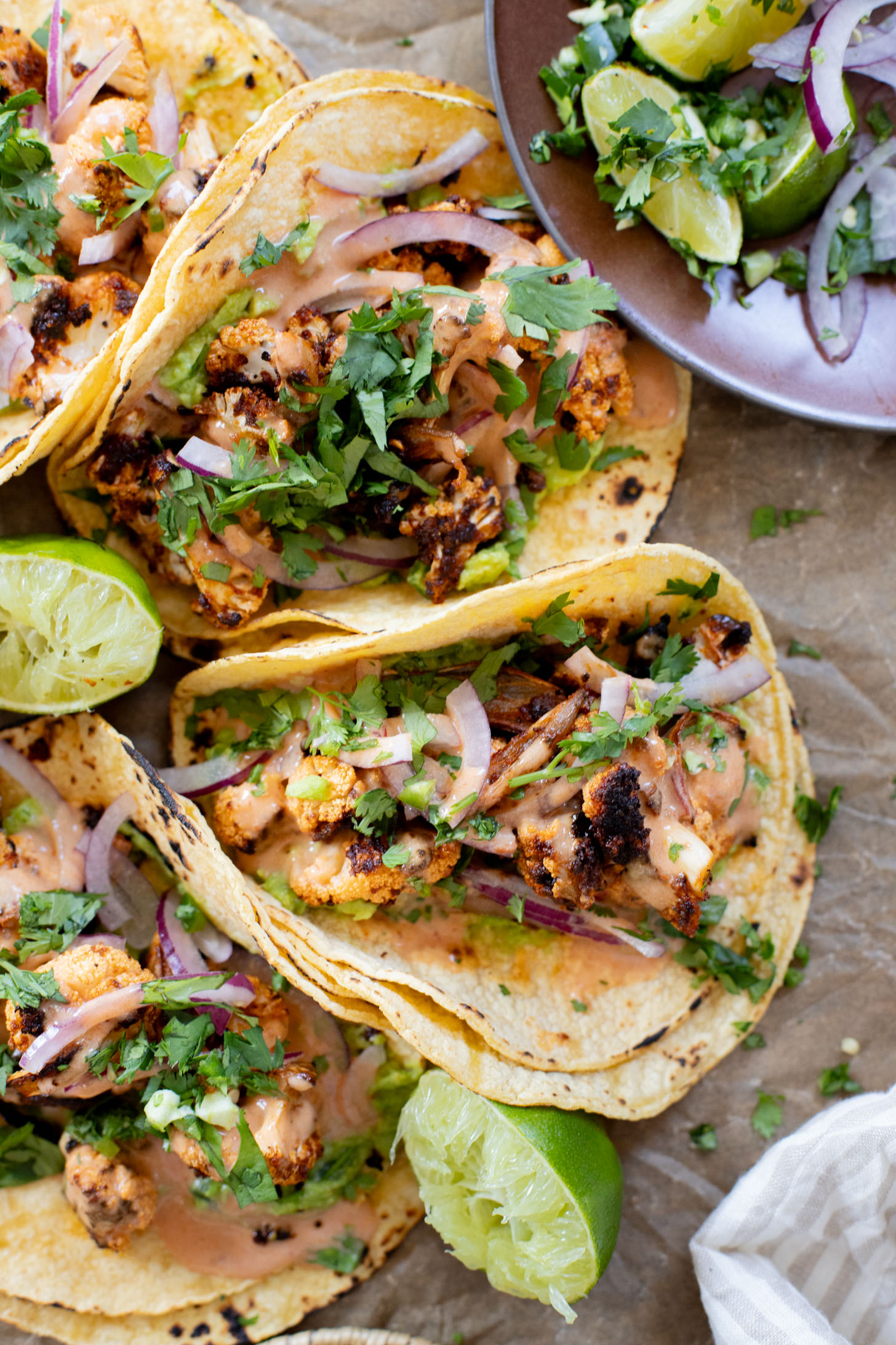 These Chipotle Cauliflower Tacos are the perfect veggie-based tacos! Crispy, roasted cauliflower, vegan chipotle yogurt sauce and simple guac | ThisSavoryVegan.com #thissavoryvegan #vegantacos #veggietacos