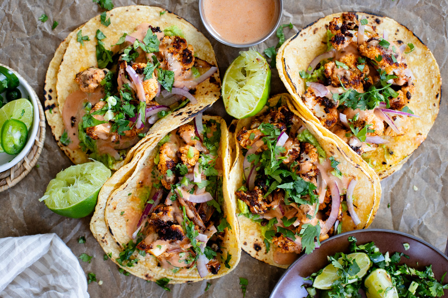 These Chipotle Cauliflower Tacos are the perfect veggie-based tacos! Crispy, roasted cauliflower, vegan chipotle yogurt sauce and simple guac | ThisSavoryVegan.com #thissavoryvegan #vegantacos #veggietacos