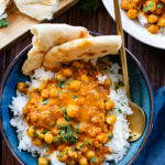 These Coconut Curry Chickpeas are vegan comfort food in a bowl. The chickpeas are braised in a coconut curry sauce and served over rice. Quick, easy, delicious dinner | ThisSavoryVegan.com #thissavoryvegan #fallrecipes #vegancurry
