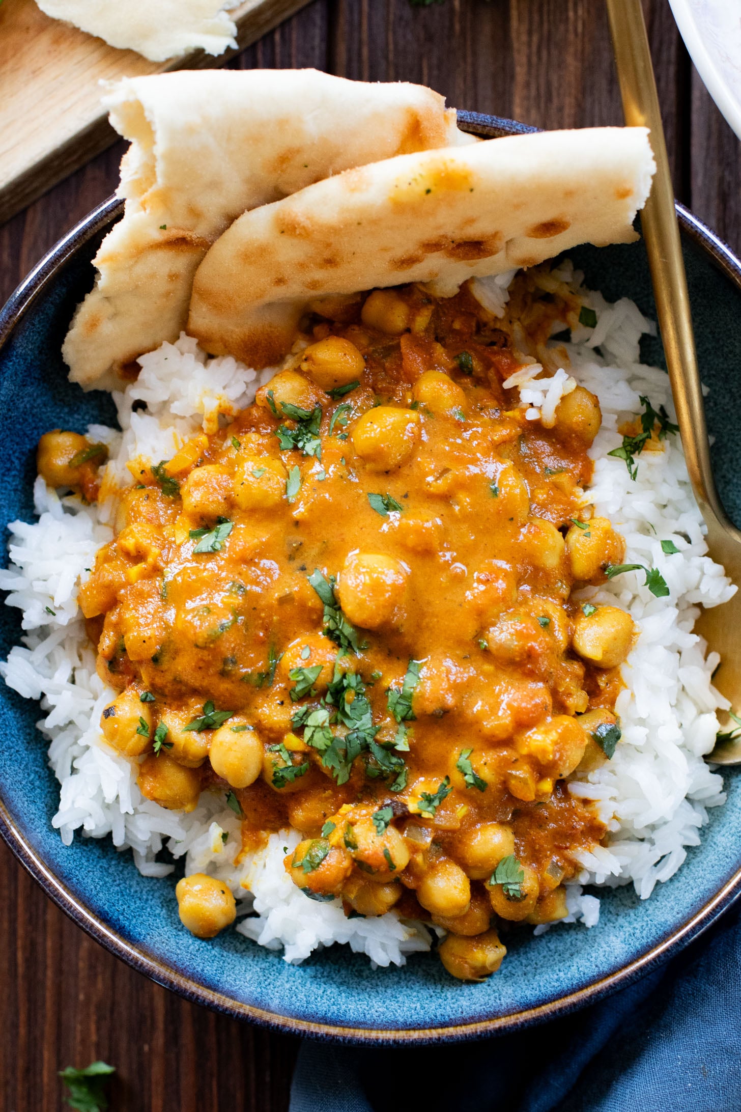 These Coconut Curry Chickpeas are vegan comfort food in a bowl. The chickpeas are braised in a coconut curry sauce and served over rice. Quick, easy, delicious dinner | ThisSavoryVegan.com #thissavoryvegan #fallrecipes #vegancurry