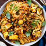 This Creamy Chipotle Pasta is made with a vegan cream sauce and topped with roasted cauliflower & chickpeas | ThisSavoryVegan.com #veganpasta #spicypasta #pastanight