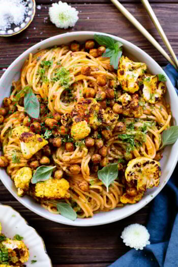 This Creamy Chipotle Pasta is made with a vegan cream sauce and topped with roasted cauliflower & chickpeas | ThisSavoryVegan.com #veganpasta #spicypasta #pastanight